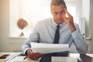 Mature man reading a document