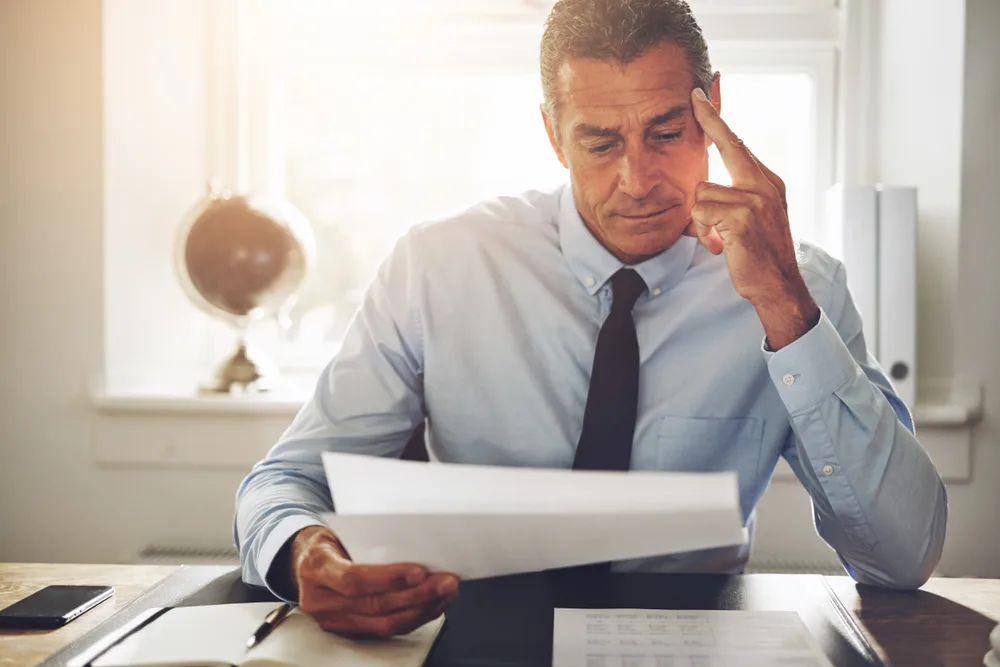 Mature man reading a document